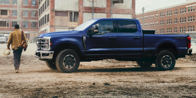 Blue 2026 Ford F-250SD heavy-duty pickup truck on a construction site