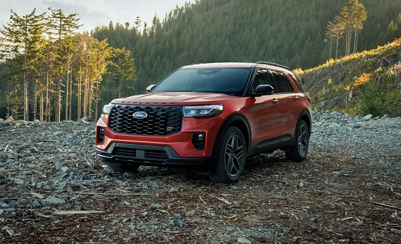 2026 Ford Explorer ST with active grille shutters, parked on a forest trail