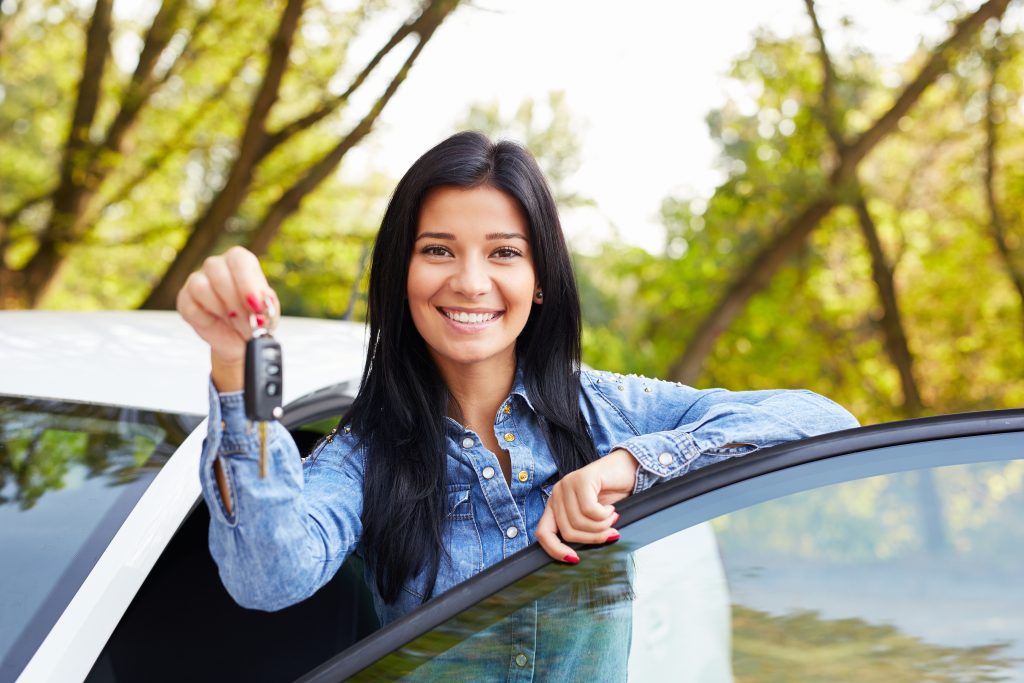 Woman holding keys, showcasing Ford's 2026 Digital Key system for enhanced security. 