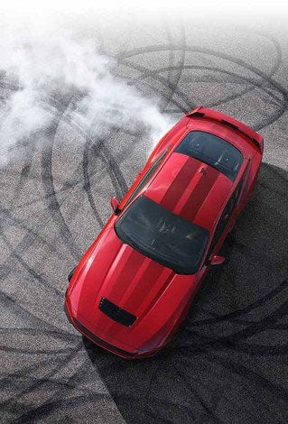 Overhead view of a 2024 Ford Mustang® model with tire tracks on pavement | Triple Crown Ford in Stephenville TX