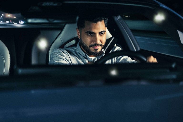 Person sitting in the driver’s seat of a parked 2024 Ford Mustang® coupe | Triple Crown Ford in Stephenville TX