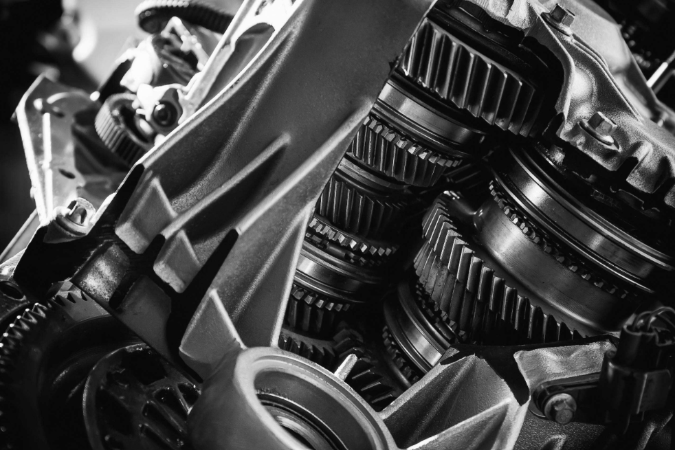 Close-up view of automotive transmission gears and mechanical components.